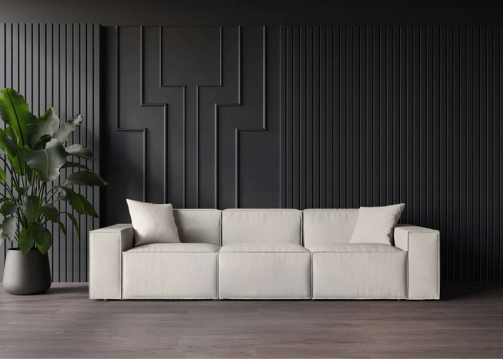 Sleek minimalist Mod Sofa in a modern room with black wall panels and plant.