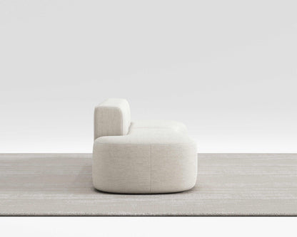Milli Sofa with sleek curved design showcasing modern style and premium comfort, ideal for flexible room arrangements.