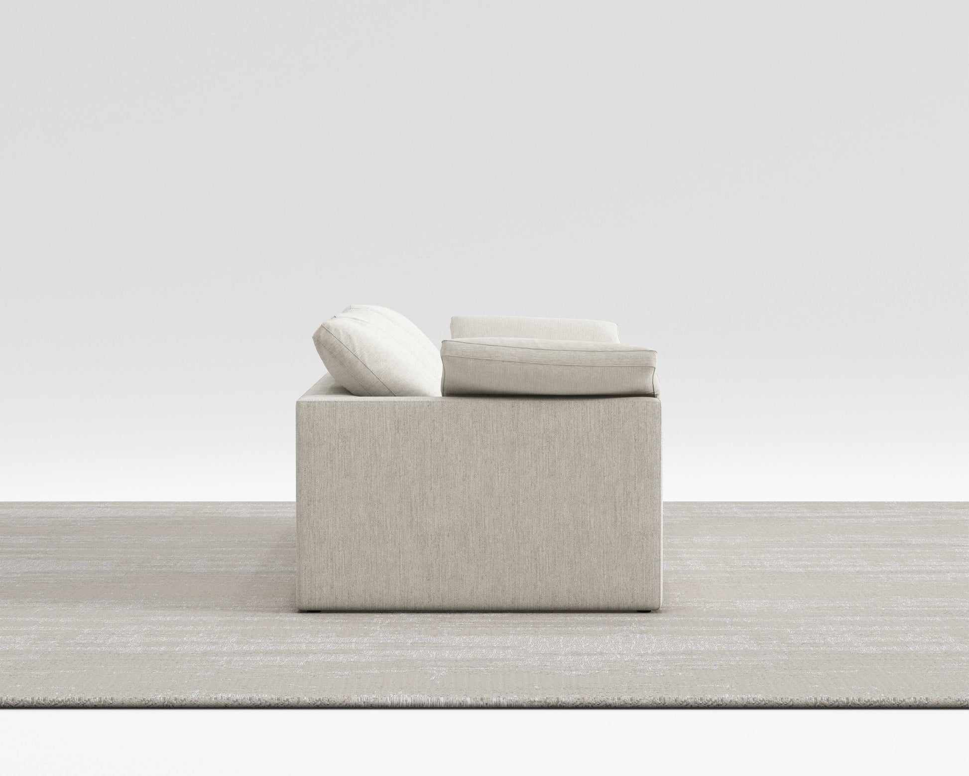 Cloud Sofa with breathable cotton-linen fabric and modular design on a neutral rug.