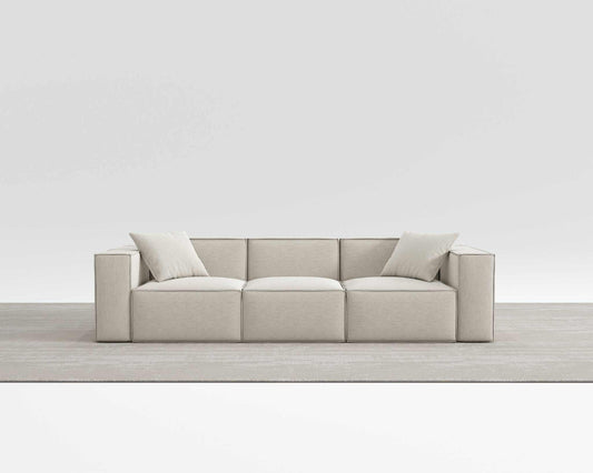 Modern beige Mod Sectional with comfy armrest pillows, made from vegan fabric.
