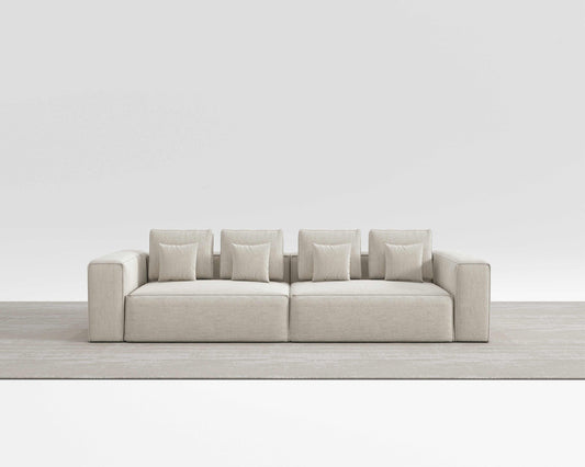 Modern HAVEN SOFA with minimalist design, sleek lines, and square pillows in a neutral setting.