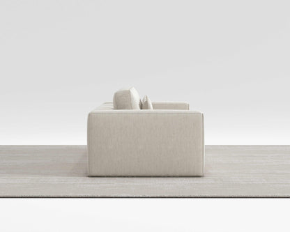 HAVEN SOFA with minimalist design and modern square pillows in a sleek, modern room setting.