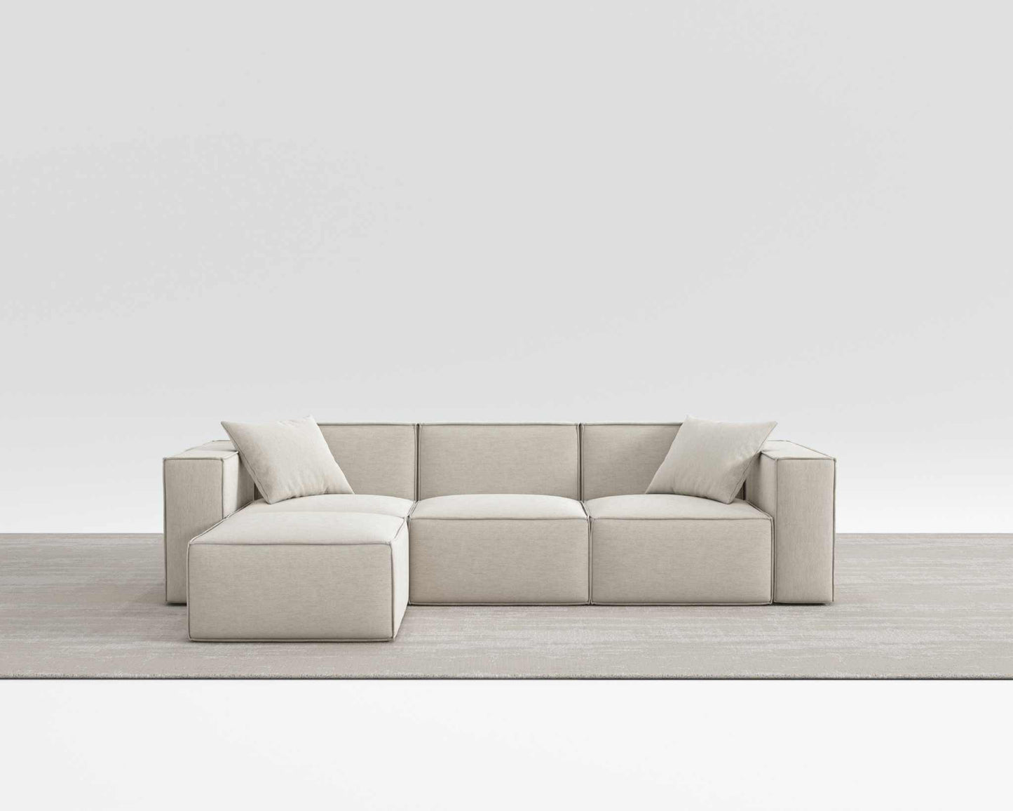 Modern Mod Sectional sofa in beige vegan fabric with armrest pillows.