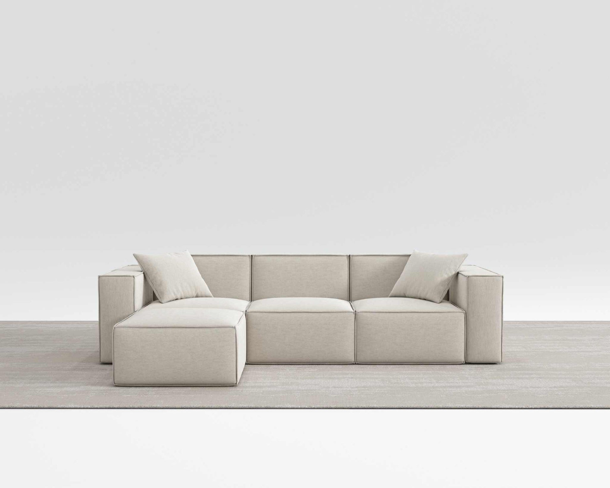 Modern Mod Sectional sofa in beige vegan fabric with armrest pillows.