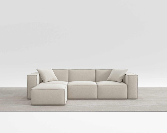 Modern Mod Sectional sofa in beige vegan fabric with armrest pillows.