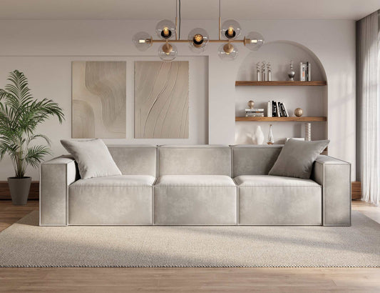 Sleek minimalist MOD SOFA with comfy armrests and durable vegan fabric in a modern living room.