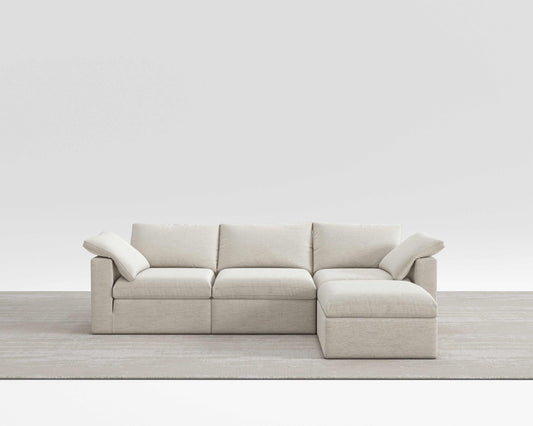 Cloud Sectional sofa with modular design and soft cotton-linen fabric on a neutral rug.