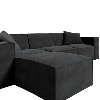 Modern black Mod Sectional with sleek design and armrest pillows.