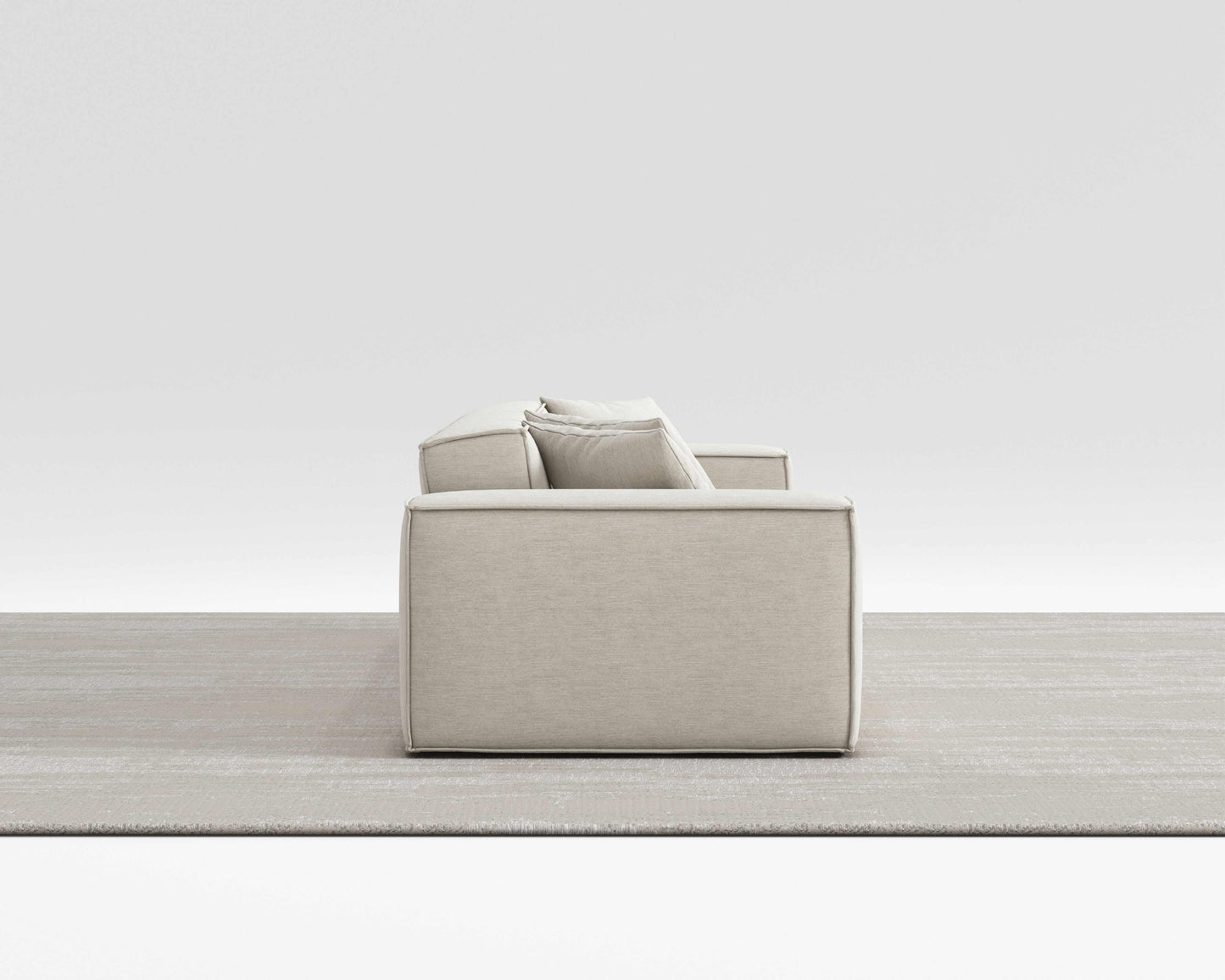 BLISS SOFA side view with minimalist design, vegan performance weave upholstery, and pillow on armrest.