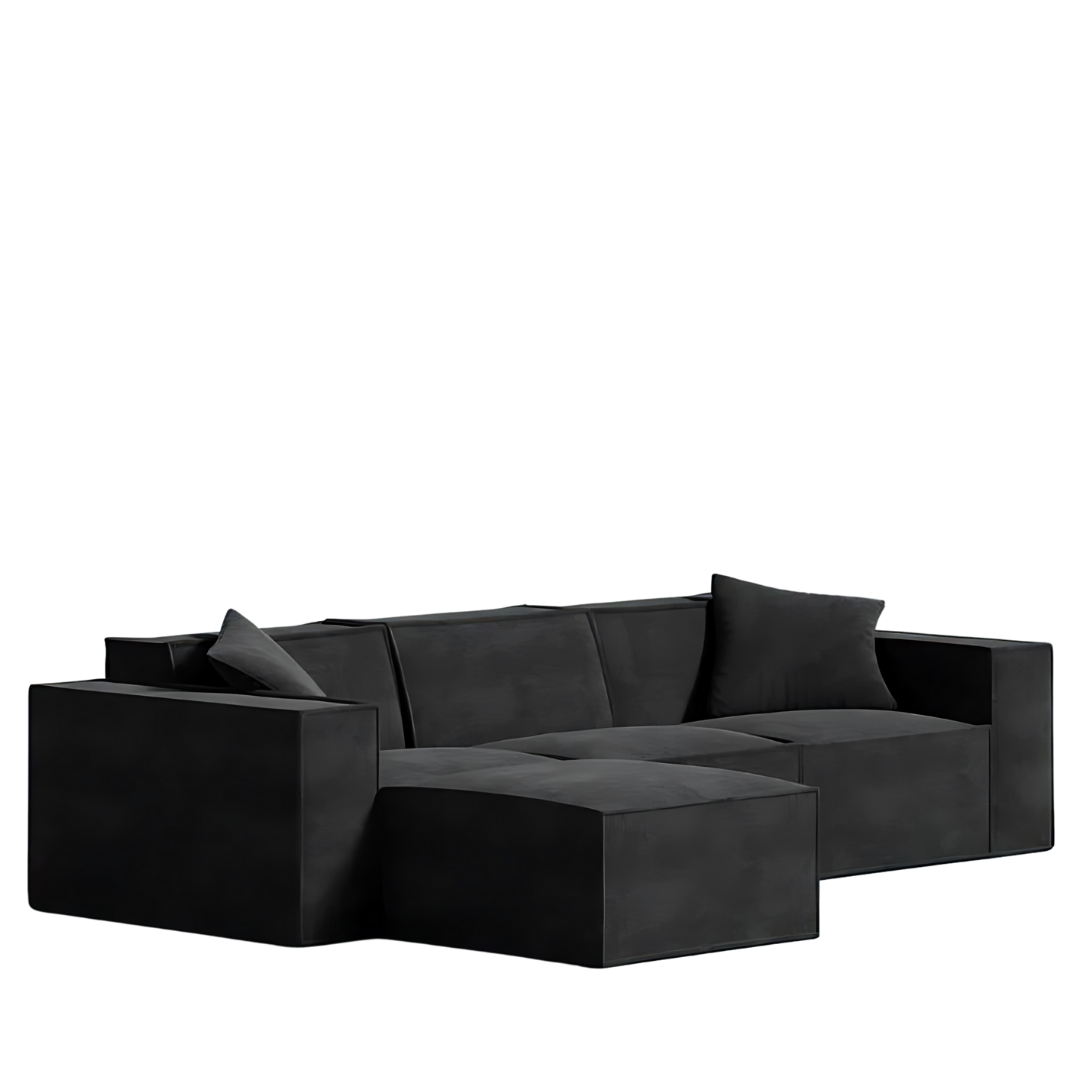 Mod Sectional sofa in sleek black, showcasing low-profile design and comfy armrest pillows, made with vegan fabric.