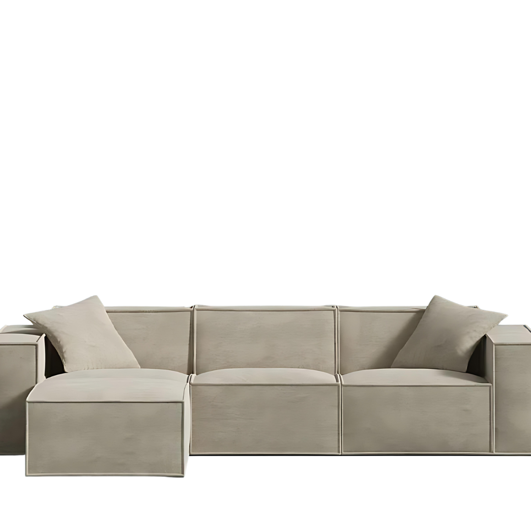 Modern sand-colored sectional sofa with sleek design and comfy armrest pillows.