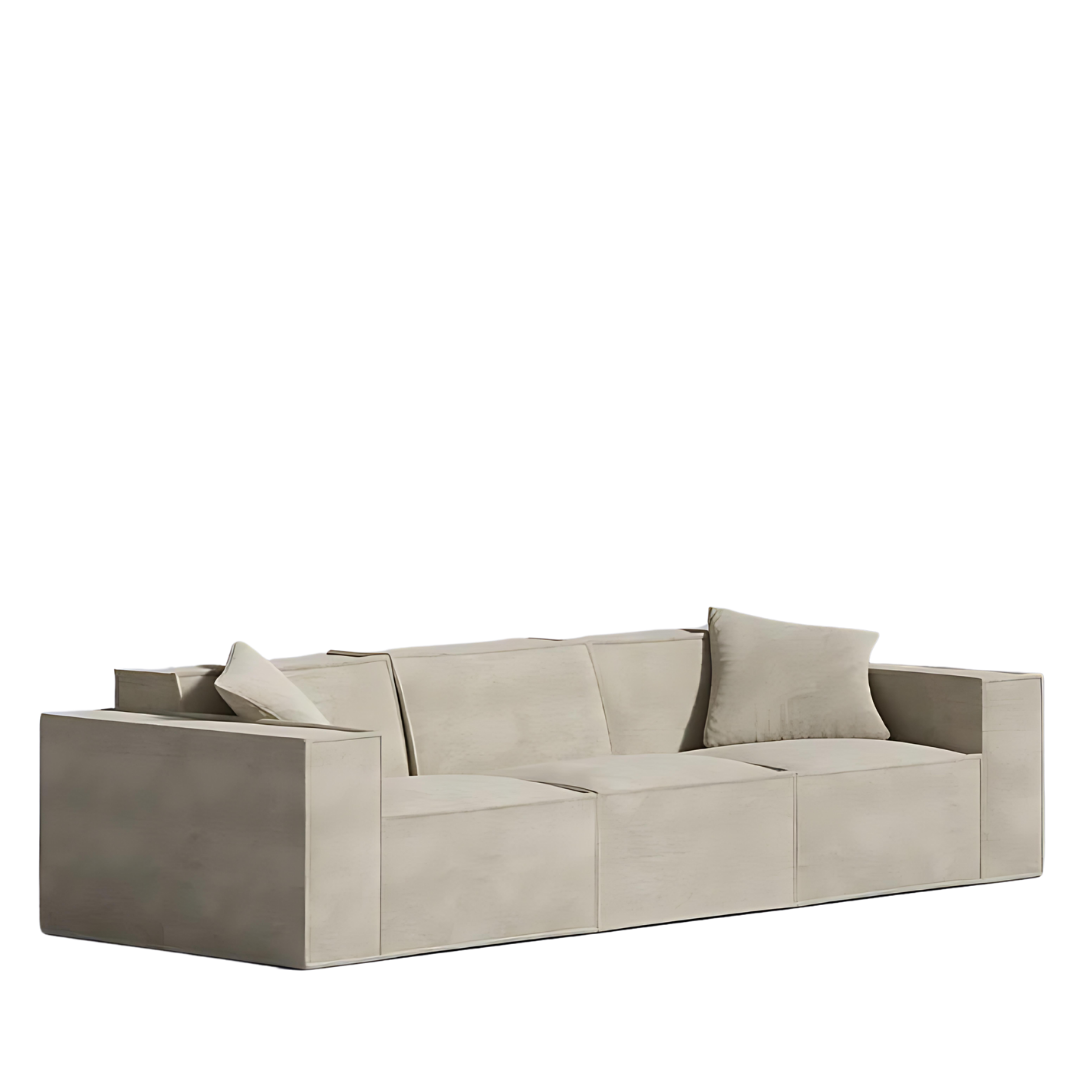 Minimalist beige Mod Sofa with low-profile design and armrest pillows.