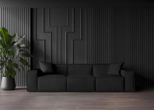 MOD SOFA CAVIAR in a sleek, minimalist design with comfy armrest pillows, set in a modern space.