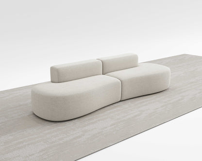 MILLI SOFA with sleek curved design for modern spaces, emphasizing comfort and modular flexibility.